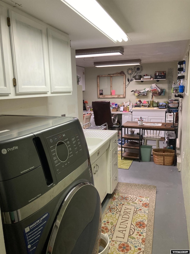 laundry area with washing machine and dryer and cabinet space