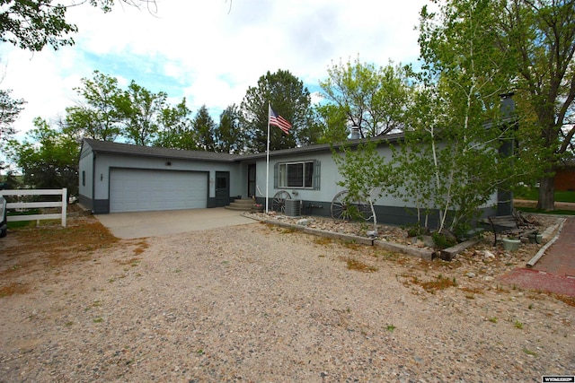 800 E 30th Ave, Torrington, WY 82240 - view of front of property with a garage, driveway, and cooling unit