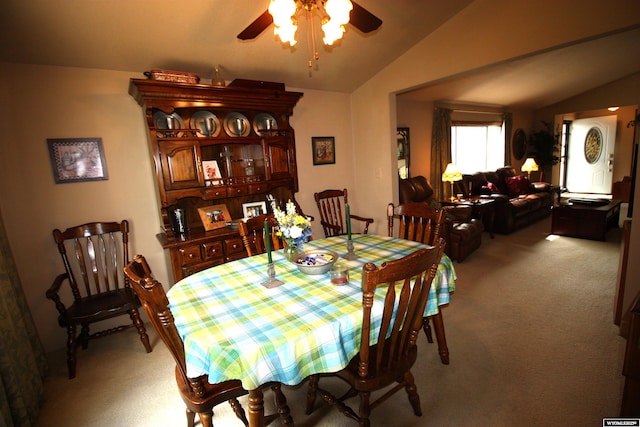 800 E 30th Ave, Torrington, WY 82240 - dining area featuring light carpet, lofted ceiling, and a ceiling fan