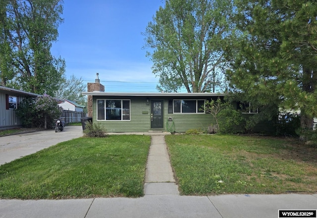 view of front of home featuring a chimney