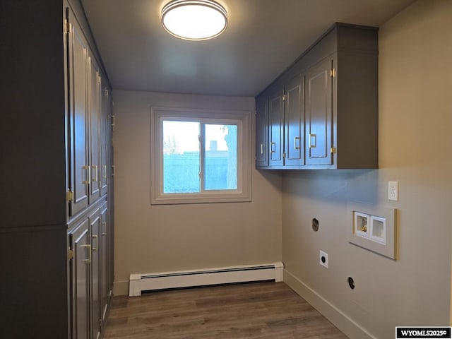 laundry room featuring electric dryer hookup, a baseboard heating unit, hookup for a washing machine, cabinet space, and baseboards