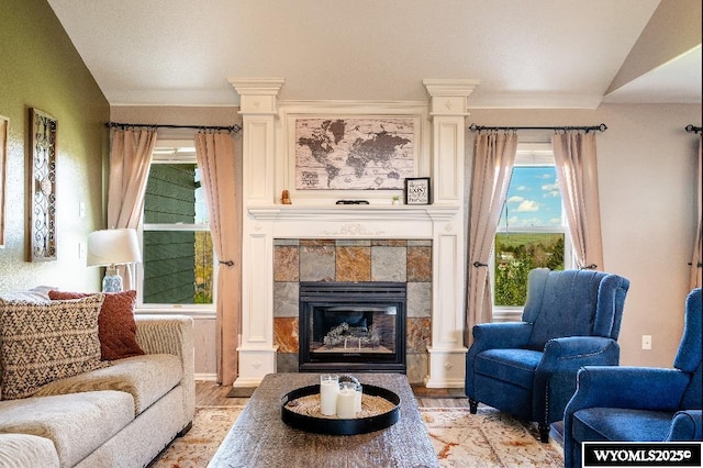1705 N Heights Cir, Sheridan, WY 82801 - living area with light wood-style floors, lofted ceiling, and a tile fireplace