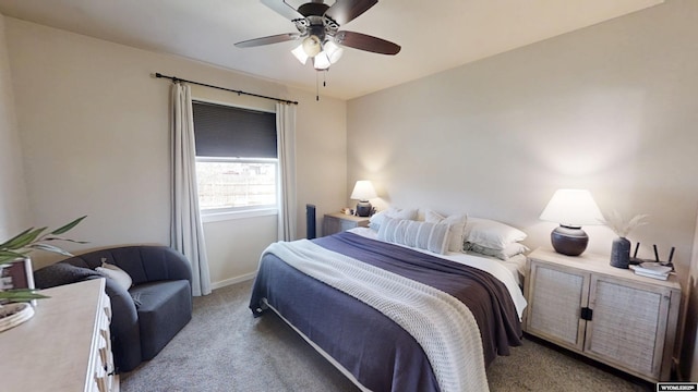 bedroom featuring light carpet, baseboards, and ceiling fan