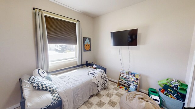 bedroom featuring baseboards