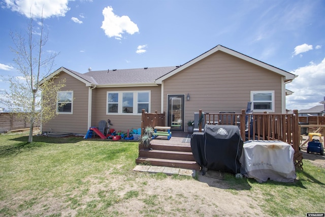 rear view of house featuring a wooden deck