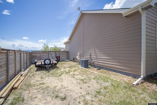 fenced backyard with central air condition unit