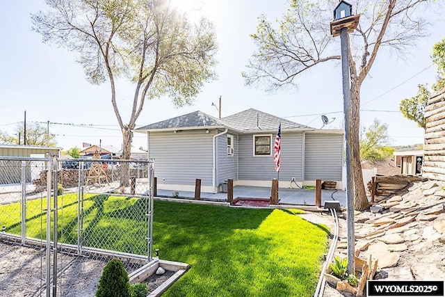508 Sidney St, Rock Springs, WY 82901 - rear view of property featuring a patio, a gate, and roof with shingles