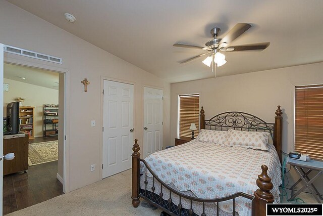15 Greve Cir, Rock Springs, WY 82901 - bedroom with lofted ceiling, ceiling fan, wood finished floors, and baseboards