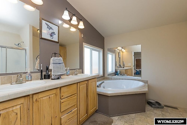 15 Greve Cir, Rock Springs, WY 82901 - full bathroom with a stall shower, a garden tub, and double vanity