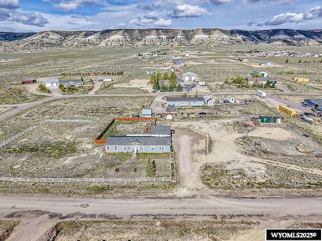 15 Greve Cir, Rock Springs, WY 82901 - aerial view of property and surrounding area with a mountain backdrop and rural landscape