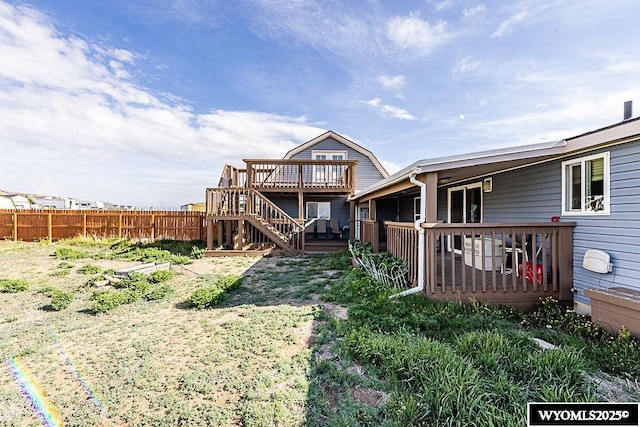 15 Greve Cir, Rock Springs, WY 82901 - rear view of house with a deck, fence, and stairway