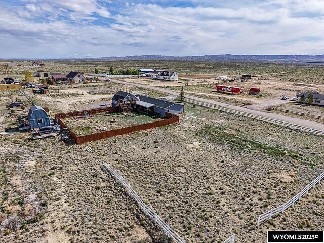 15 Greve Cir, Rock Springs, WY 82901 - drone / aerial view of a mountain backdrop and a desert landscape