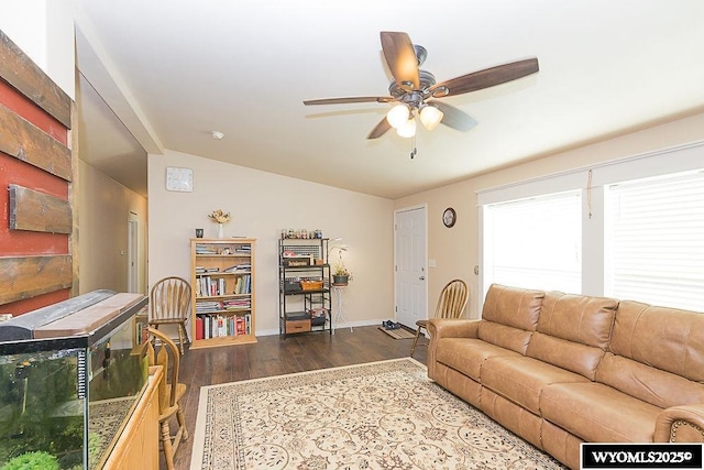 15 Greve Cir, Rock Springs, WY 82901 - living area featuring dark wood-type flooring, ceiling fan, baseboards, and lofted ceiling