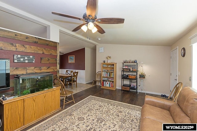 15 Greve Cir, Rock Springs, WY 82901 - living room featuring dark wood finished floors, a ceiling fan, vaulted ceiling, and baseboards