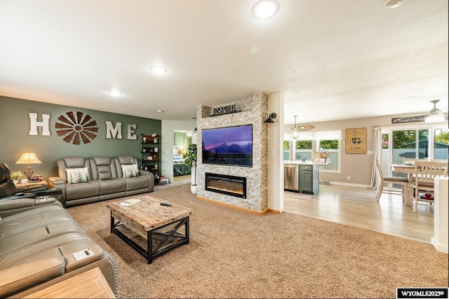 750 N Adams Ave, Buffalo, WY 82834 - living room featuring light colored carpet, a fireplace, baseboards, and recessed lighting