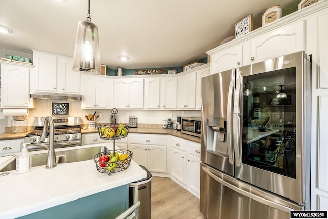 750 N Adams Ave, Buffalo, WY 82834 - kitchen featuring appliances with stainless steel finishes, under cabinet range hood, white cabinetry, and recessed lighting