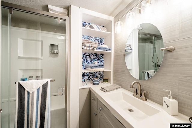 750 N Adams Ave, Buffalo, WY 82834 - bathroom with a shower stall, decorative backsplash, and vanity