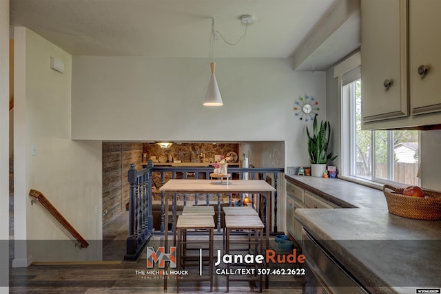 dining area with wood finished floors and baseboards