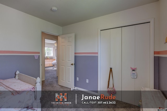 unfurnished bedroom featuring carpet floors and a closet