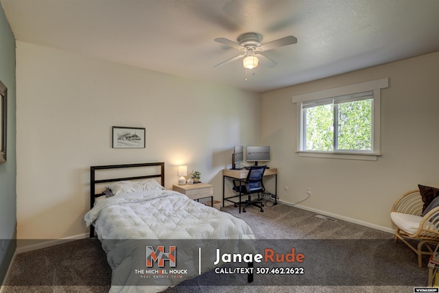 carpeted bedroom featuring baseboards
