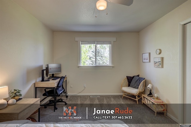 carpeted home office featuring baseboards and a ceiling fan