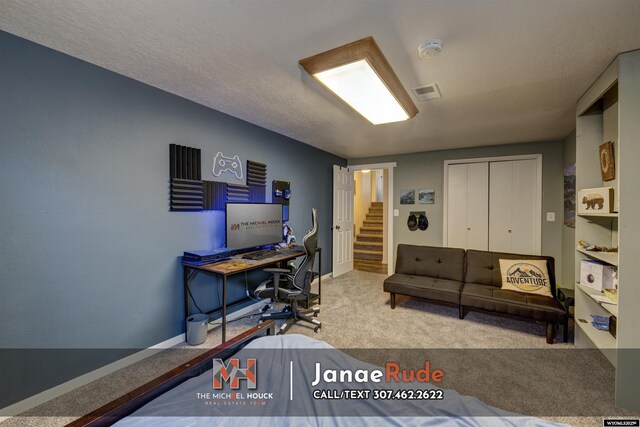 carpeted office space featuring baseboards