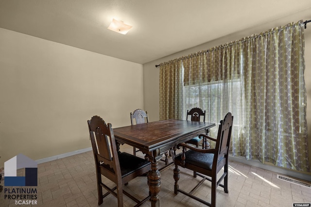 dining space with baseboards
