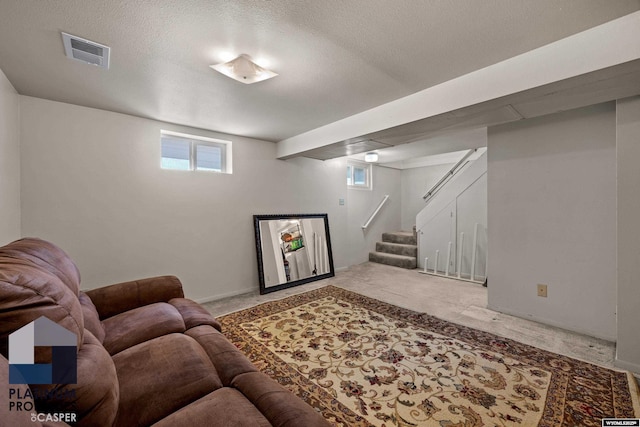 carpeted living room featuring stairs