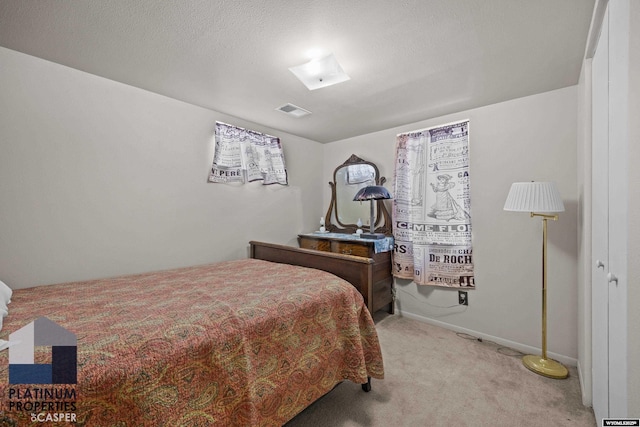 bedroom featuring carpet and baseboards