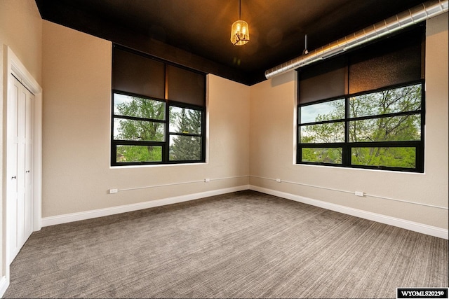 1030 N Main St, Sheridan, WY 82801 - carpeted empty room featuring plenty of natural light and baseboards