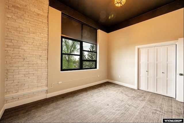 1030 N Main St, Sheridan, WY 82801 - unfurnished bedroom featuring baseboards and a closet