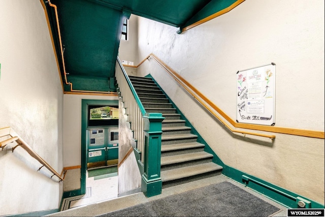 1030 N Main St, Sheridan, WY 82801 - stairs with a textured wall and baseboards