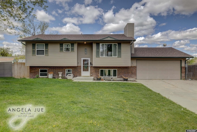 raised ranch featuring a chimney, a garage, concrete driveway, and roof with shingles