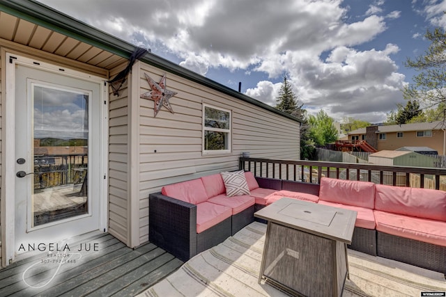 deck featuring outdoor lounge area