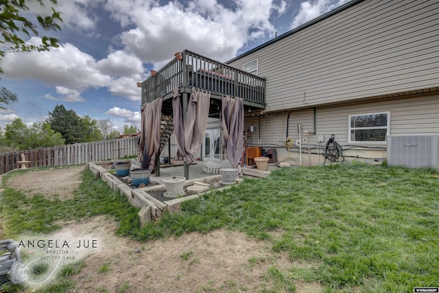 back of house with a wooden deck and a patio area