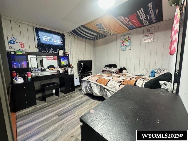 408 S 18th, Worland, WY 82401 - bedroom featuring wood finished floors and an office area