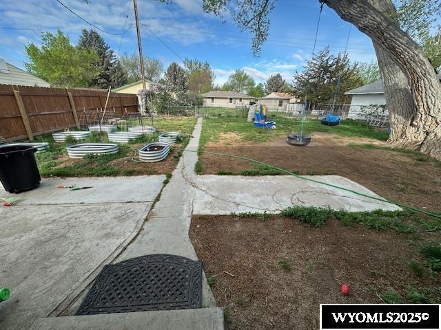 408 S 18th, Worland, WY 82401 - fenced backyard with a garden