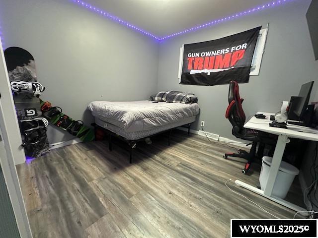 408 S 18th, Worland, WY 82401 - bedroom featuring wood finished floors and baseboards