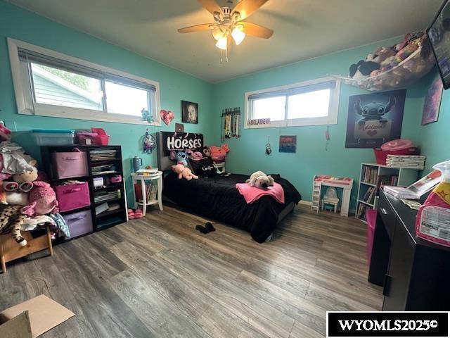 408 S 18th, Worland, WY 82401 - bedroom featuring wood finished floors and a ceiling fan