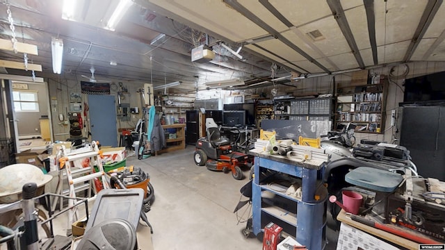 basement featuring a workshop area and a garage