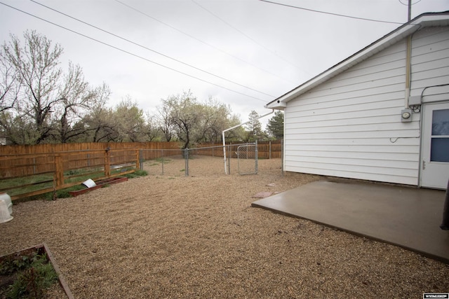 fenced backyard with a patio