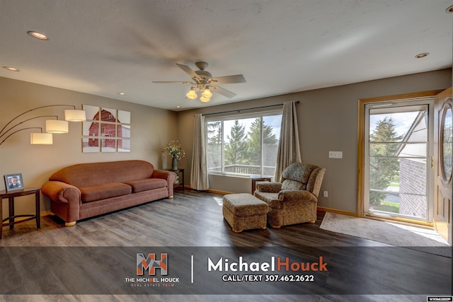 living room featuring baseboards, wood finished floors, ceiling fan, and recessed lighting