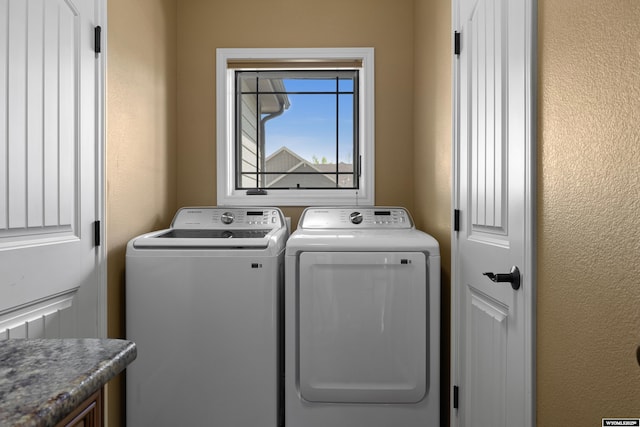 laundry area with washing machine and dryer