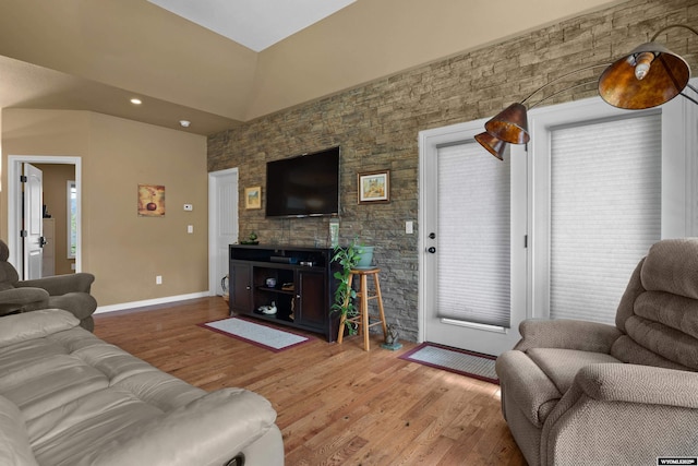 living area with light wood-type flooring, baseboards, and recessed lighting
