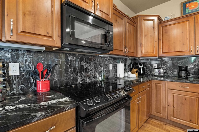 kitchen with black appliances, brown cabinetry, and decorative backsplash