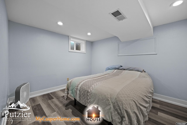 bedroom with wood finished floors, recessed lighting, and baseboards