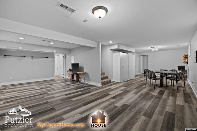 living area featuring wood finished floors, recessed lighting, stairs, and baseboards