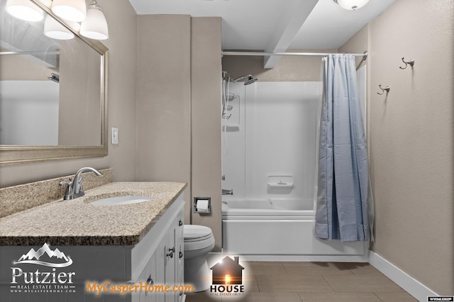 bathroom featuring shower / bath combo, vanity, toilet, tile patterned floors, and baseboards