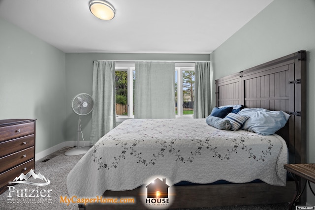 carpeted bedroom featuring baseboards