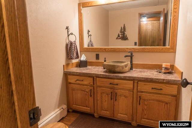 19A Kolman Ranch Rd, Rock Springs, WY 82901 - bathroom featuring baseboard heating and vanity